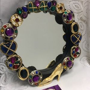 Jewelry collage mirror.